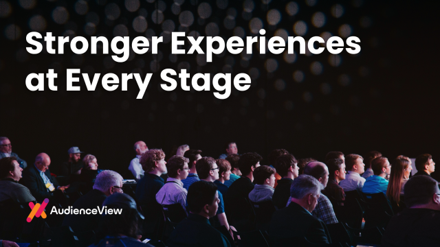 Large white headline reading 'Stronger Experiences at Every Stage' over a dark auditorium audience; AudienceView logo at bottom left.